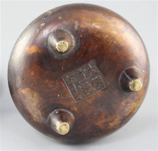 A Chinese bronze ding censer and stand, width 15.5cm